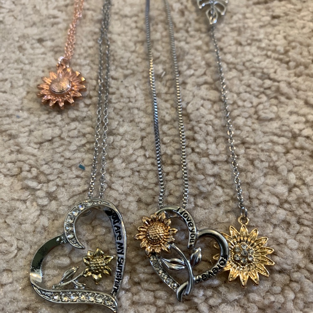 3 sunflower necklaces and a bracelet